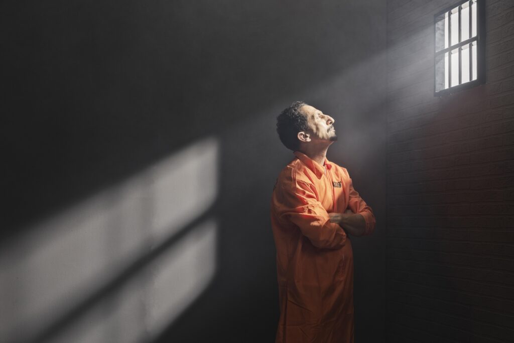 Prisoners seated in a corridor during the reported Ghezel
